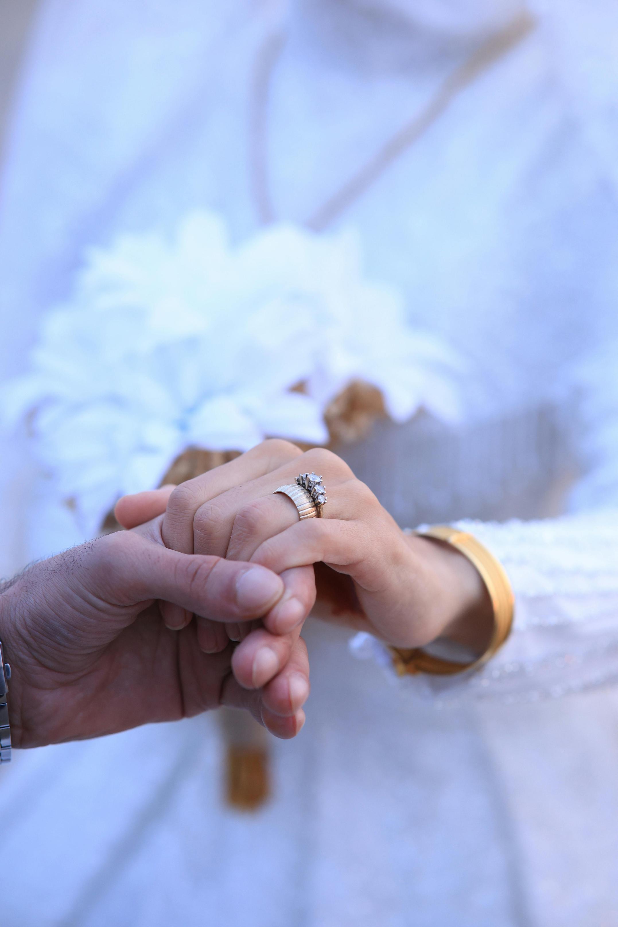 who holds the rings at a wedding